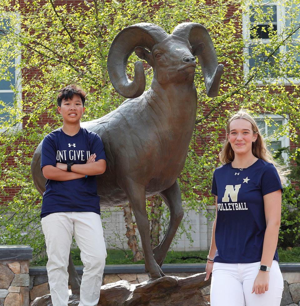 Marshfield residents Ngoc "MJ" Vo and Grace Burgoyne stand next to the Marshfield Ram at Marshfield High. Both young women have been accepted to the U.S. Naval Academy.