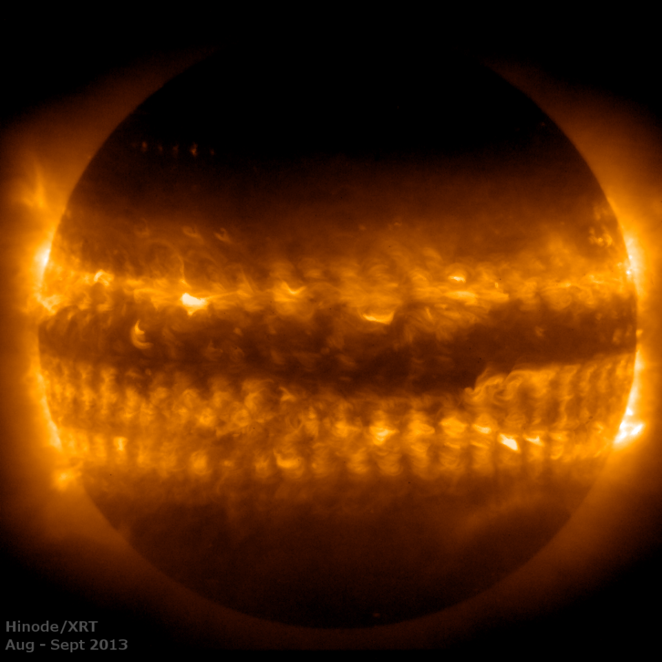 This image was created by combining 54 observations of the sun's outer atmosphere, called the corona, in 2013. The horizontal bands above and below the equator are "activity belts" that start closer to the poles and gradually move to low latitudes as the 11-year solar cycle progresses. The dark spaces are known as the quiet sun. <cite>NASA/Hinode/XRT</cite>