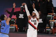 Portland Trail Blazers' Carmelo Anthony (00) shoots a three-point basket during the second half of an NBA basketball game against the Memphis Grizzlies, Friday, July 31, 2020, in Lake Buena Vista, Fla. (Mike Ehrmann/Pool Photo via AP)