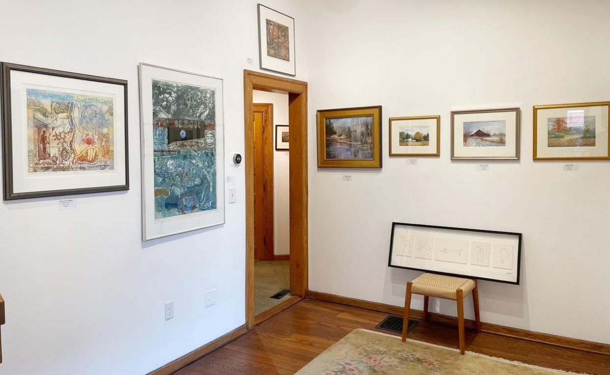 The "refuge" room at Venue Fine Art & Gifts in Bloomington has artwork from various artists that was rescued from garages, basements and other areas where they were hidden. Now they are on display and for sale.