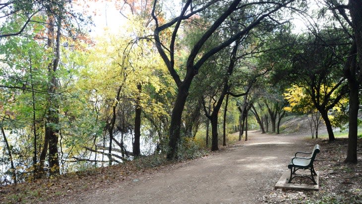 <span class="article__caption">A hiking trail alongside Lady Bird Lake in Austin</span> (Photo: Chris Rogers/Getty)