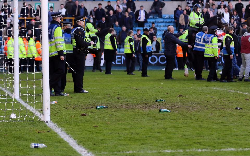 Three arrested after Millwall's shock FA Cup win over Leicester following pitch invasion