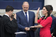 Florida Lt. Gov. Jeanette Nunez, right, is sworn in by Justice John Curiel as her husband Adrian, center, looks on during an inauguration ceremony at the Old Capitol, Tuesday, Jan. 3, 2023, in Tallahassee, Fla. (AP Photo/Lynne Sladky)