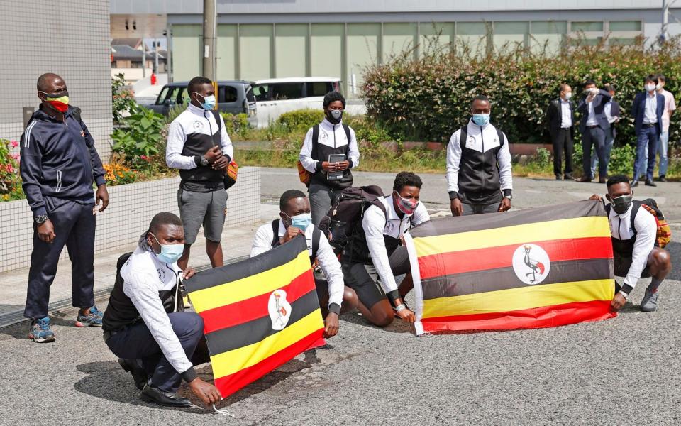 Members of Uganda's Olympic team pose for a photo on their arrival at their host town Izumisano, Osaka, in western Japan on Sunday - Suo Takekuma/Kyodo News