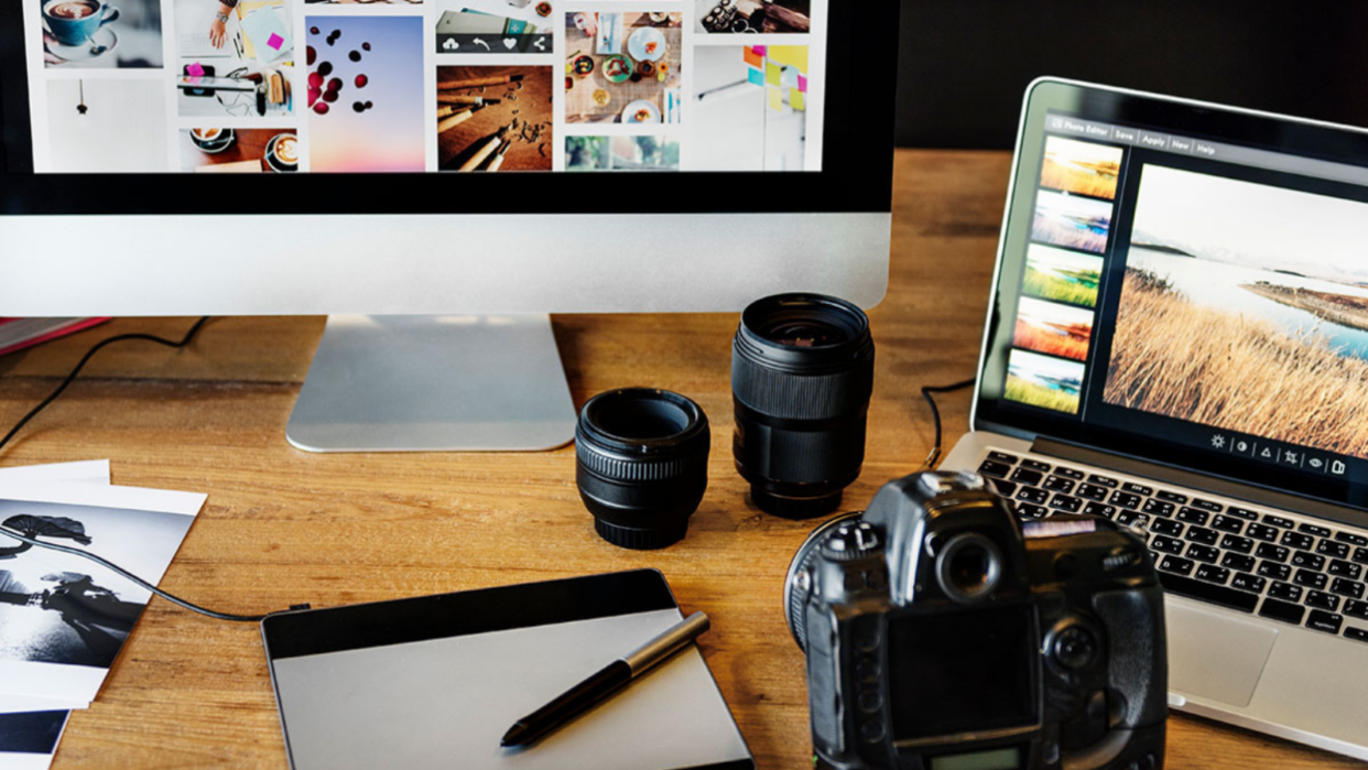 Multiple monitors and cameras on table