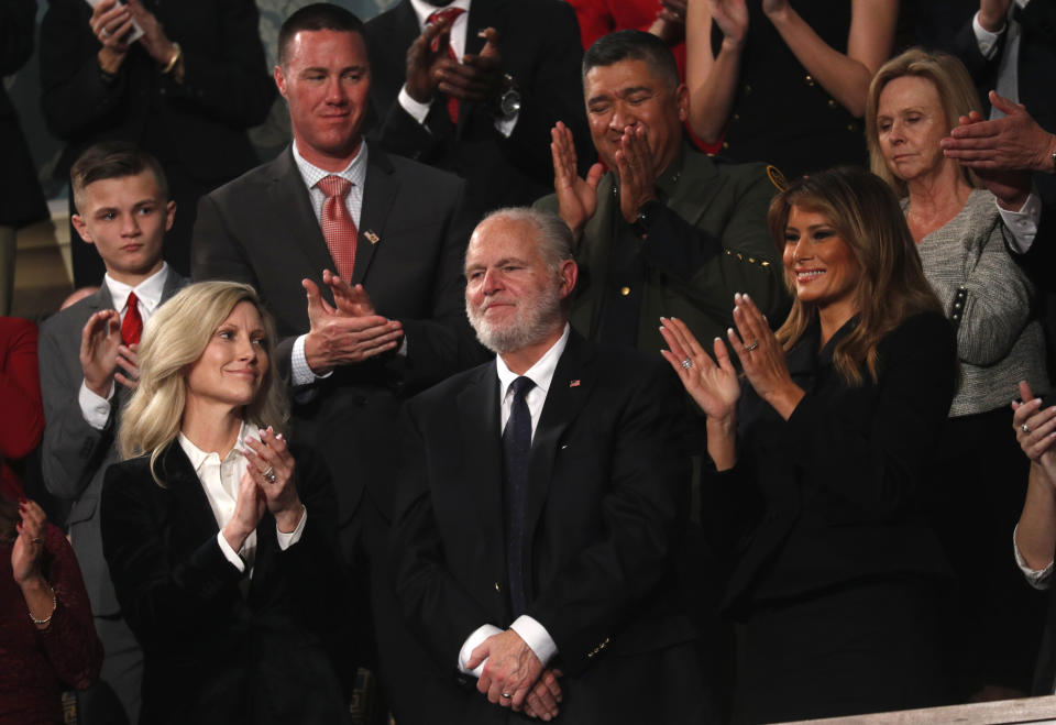 Rush Limbaugh reacts as first Lady Melania Trump, and his wife Kathryn, applaud, as President Donald Trump delivers his State of the Union address to a joint session of Congress on Capitol Hill in Washington, Tuesday, Feb. 4, 2020. (Leah Millis/Pool via AP)