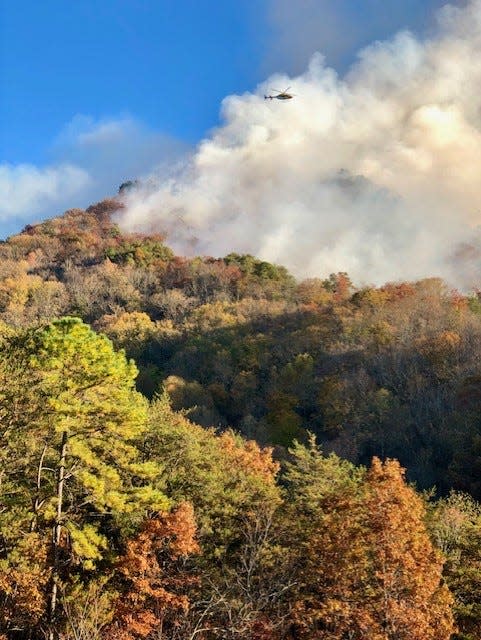 A helicopter flies over part of the Collett Ridge Fire near Andrews.