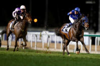 Horse Racing - Dubai World Cup - Meydan Racecourse, Dubai - 25/3/17 - William Buick rides Jack Hobbs to the finish line to win the eighth race. REUTERS/Ahmed Jadallah