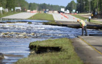 Flooding from Sutton Lake has washed away part of U.S. 421 in New Hanover County just south of the Pender County line in Wilmington, N.C., Friday, Sept. 21, 2018. (Matt Born /The Star-News via AP)