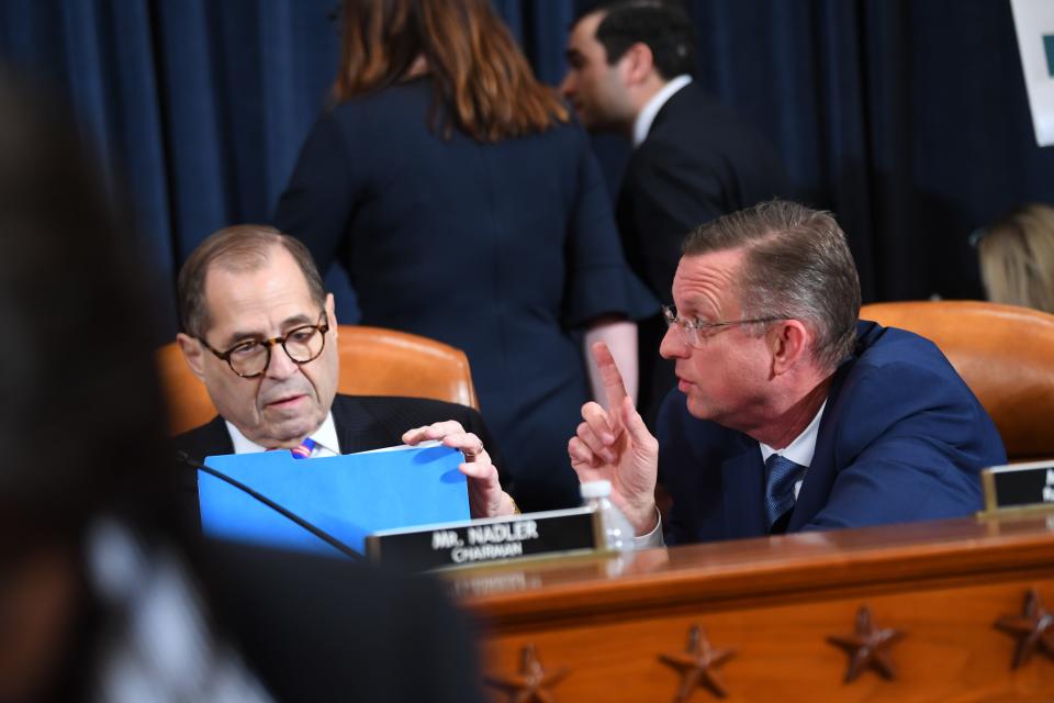 Ranking member Rep. Doug Collins, R-Ga.,right, speaks with House Judiciary Committee Chairman Rep. Jerrold Nadler, D-N.Y., after the House Judiciary Committee held the first formal impeachment inquiry of President Donald Trump to explore how the Constitution applies to allegations of misconduct.