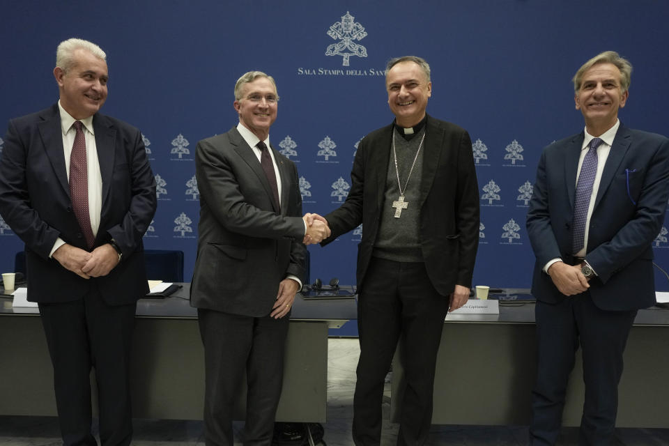 From left, Pietro Zander, head of the artistic heritage section of the Fabric of St. Peter, Patrick Kelly, Supreme Knight of the Knights of Columbus, Cardinal Mauro Gambetti, Archpriest of the Papal Basilica of St. Peter and President of the Fabric of St. Peter, and Alberto Capitanucci, technical area manager of the Fabric of St. Peter, pose for photographers at the of a press conference at The Vatican, Monday, Jan. 11, 2024. Vatican officials unveiled plans, Thursday, Jan. 11, 2024, for a year-long, 700,000 euro restoration of the 17th century, 95ft-tall bronze canopy by Giovan Lorenzo Bernini surmounting the papal Altar of the Confession of the Basilica, pledging to complete the first comprehensive work on this masterpiece in 250 years before Pope Francis' big 2025 Jubilee. (AP Photo/Andrew Medichini)