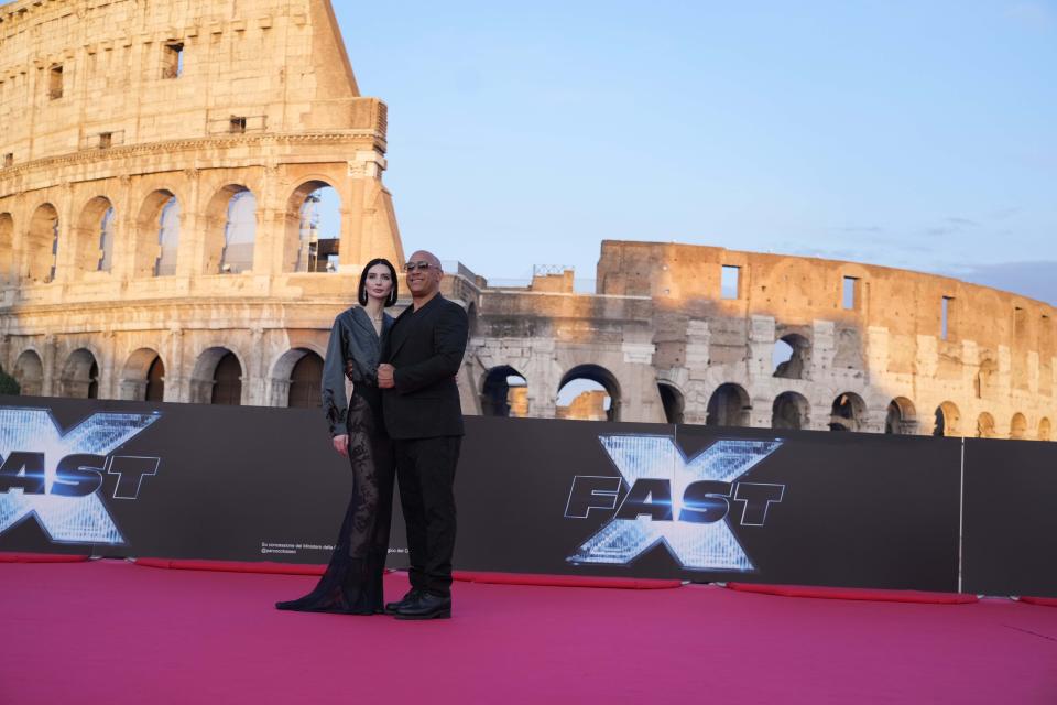 Actor Vin Diesel poses flanked by Meadow Rain Walker upon arrival at the world premiere of the film 'Fast X' in Rome, Friday, May 12, 2023. (AP Photo/Gregorio Borgia)