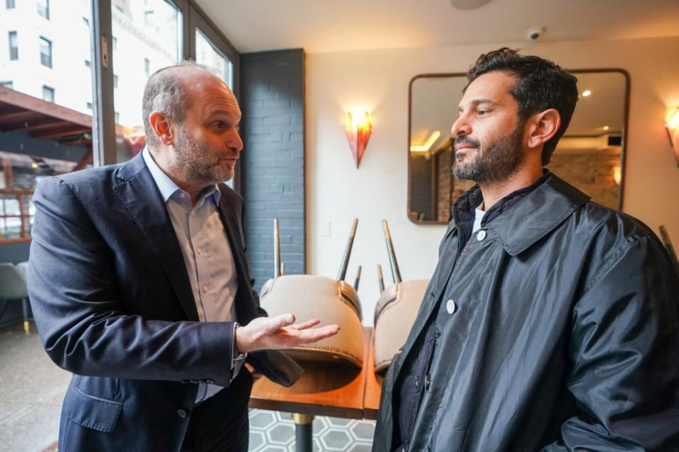 Rabbi Chaim Steinmetz visits to show support speaking to (right) the chef Guy Kairi. Robert Miller