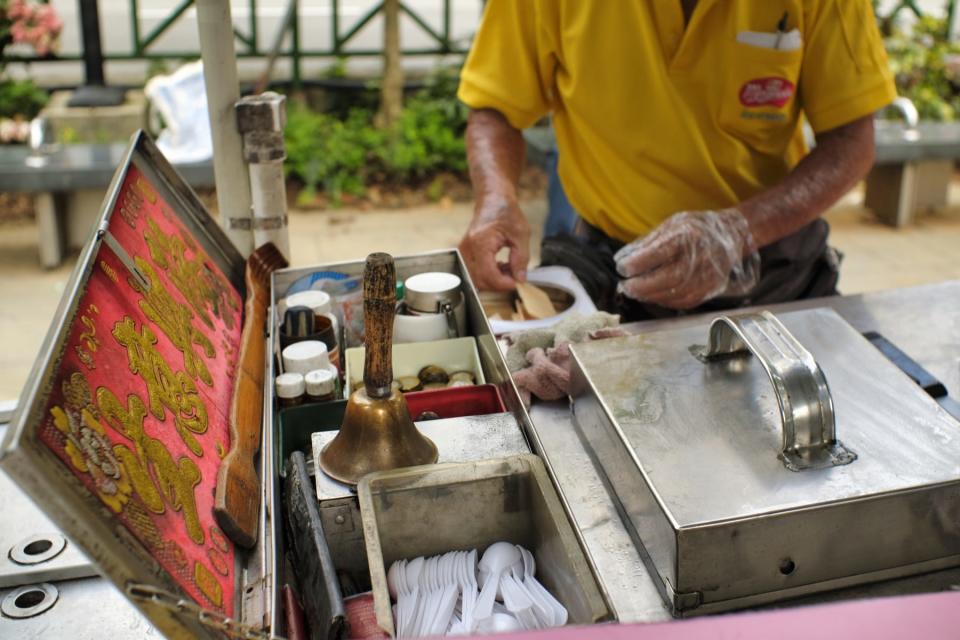 A close-up of a traditional ice cream cart.