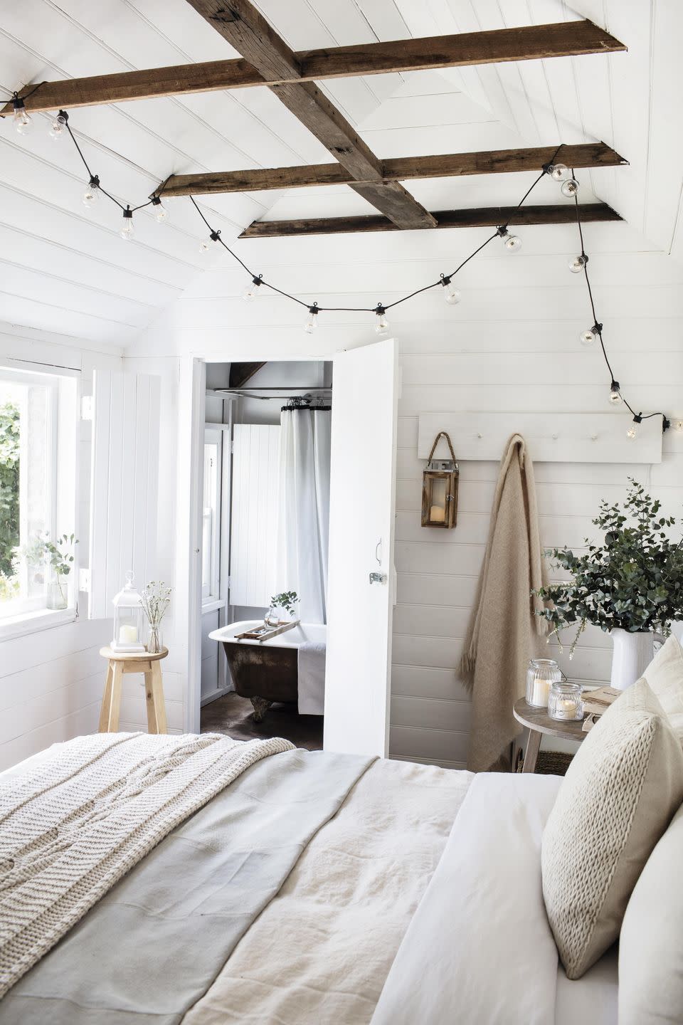 1) White bedroom ideas: wooden cladding