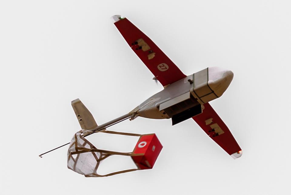 A Zipline drone releases a blood package in southern Rwanda.