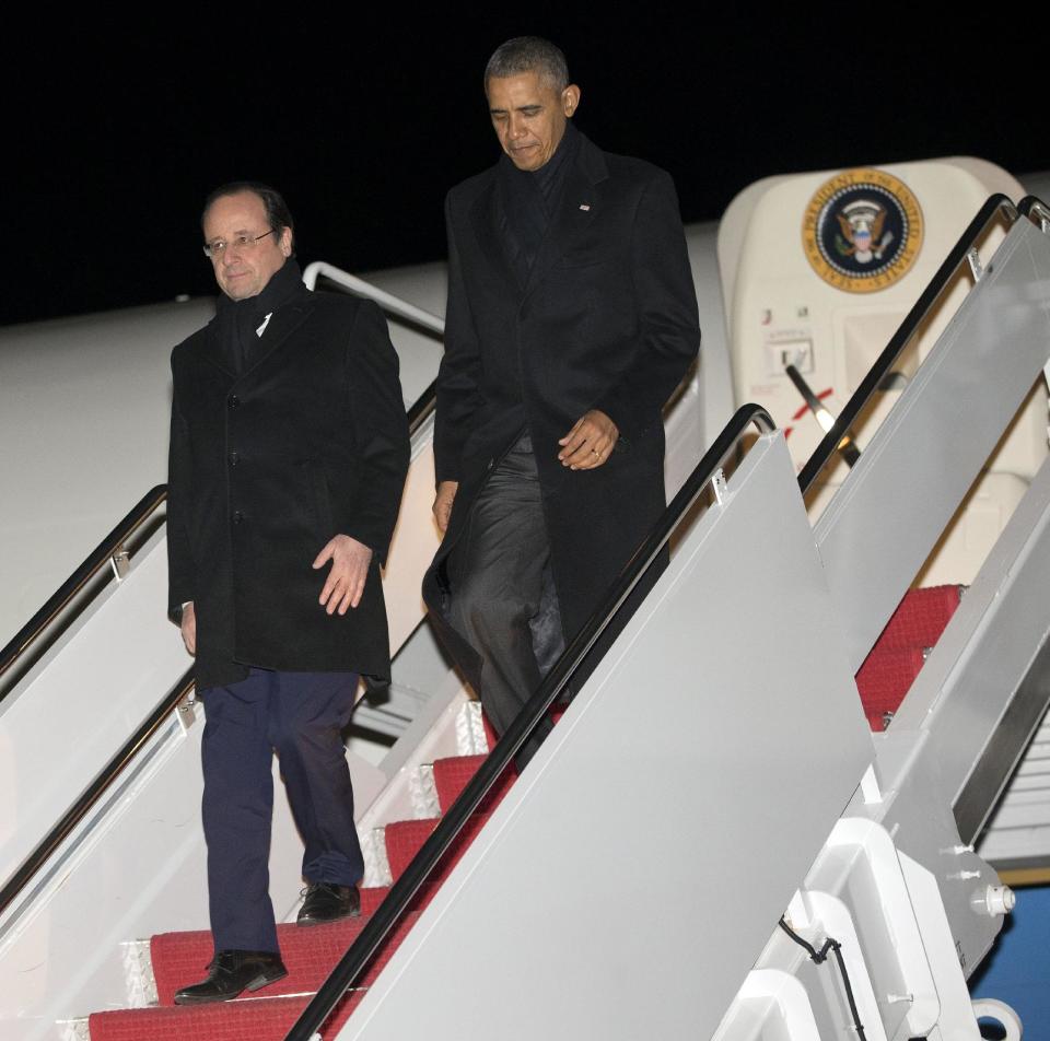 President Barack Obama and French President Francois Hollande, walk down the staits during their return to Andrews Air Force Base, Md., on Air Force One, Monday, Feb. 10, 2014. They where returning for Charlottesville, Va., after touring Monticello, President Thomas Jefferson's estate. (AP Photo/Pablo Martinez Monsivais)