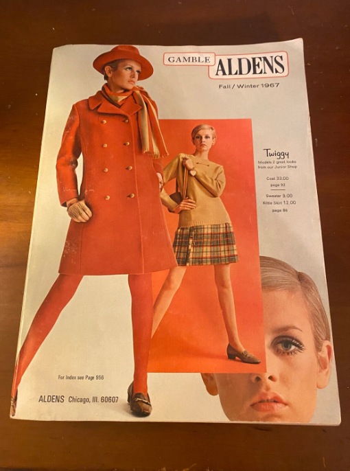 Cover of Gamble Aldens Fall/Winter 1967 catalog featuring Twiggy in an orange coat, scarf, and matching hat, and in a beige sweater with a plaid skirt