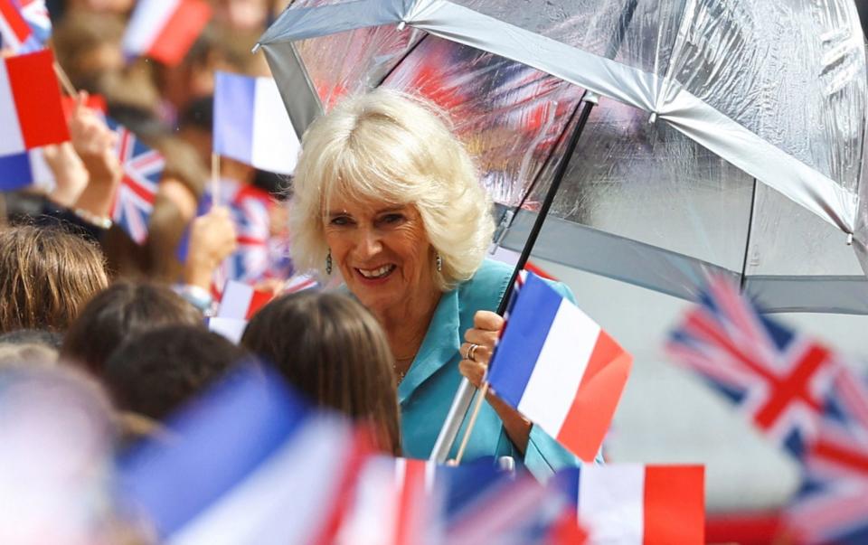 Queen Camilla speaks to members of the public gathered outside the Hotel de Ville in Bordeaux