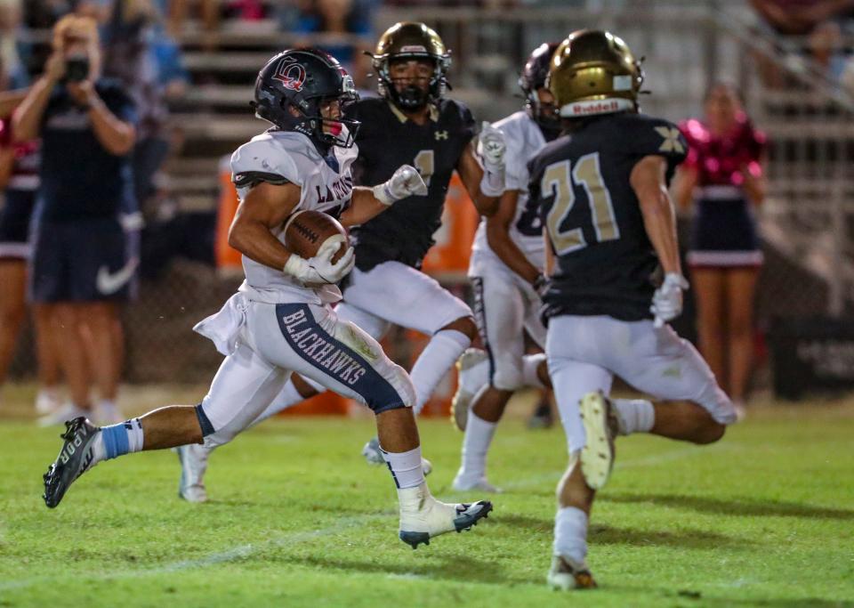 Isaiah Alvarado, shown here running the ball versus Xavier Prep on Friday, Oct. 14, 2022,  has had a breakthrough season after two years of battling injuries.