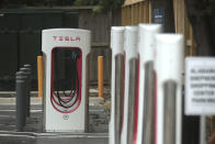 A Tesla supercharging location is seen on Kipling Street, June 3, 2024 in Houston. Charging stations have been hit particularly hard by thieves who likely want to sell the highly conductive copper wiring inside the cables at near-record prices. But authorities and charging company officials say similar thefts are increasing across the U.S. as more charging stations are built. (AP Photo/Lekan Oyekanmi)