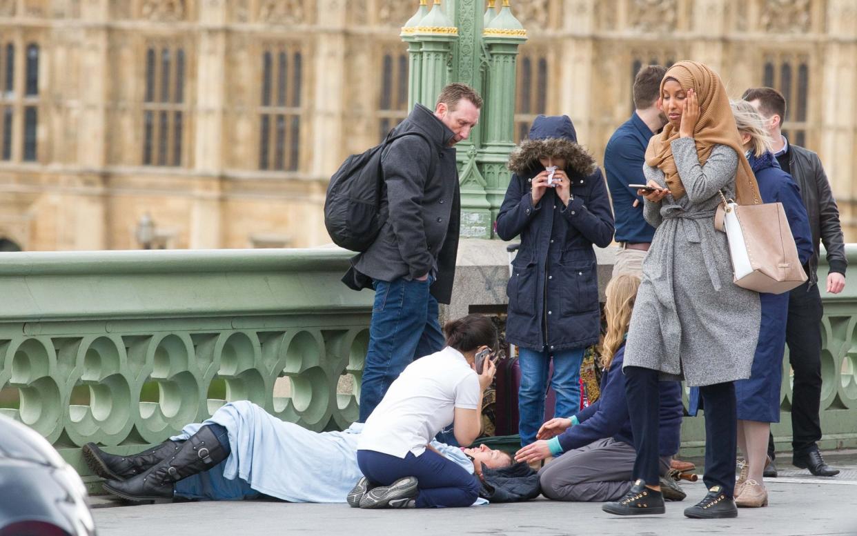 This image of a woman in a hijab at the scene of the terrorist incident on Westminster Bridge became a focus for anti-Islamic trolls - Jamie Lorriman