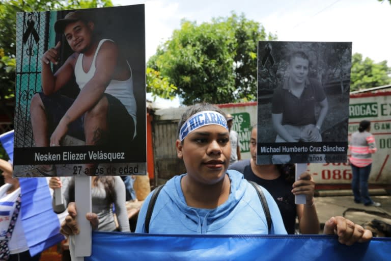 Nicaraguan demonstrators display images of students killed during recent demonstrations