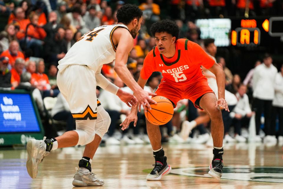 Colorado State's Jalen Lake (15) defends during a college basketball game against Wyoming at Moby Arena on Friday, Feb. 24, 2023 in Fort Collins, Colo. The Rams won 84-71.