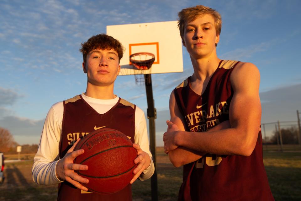 Silver Lake senior Sam Kaff, left, and junior Troy Heiman stand outside of the elementary school gym where the team practices Thursday afternoon. The two have started interchangeably as point guards for the team after the graduation of last year's point guard Andrew Osterhaus.