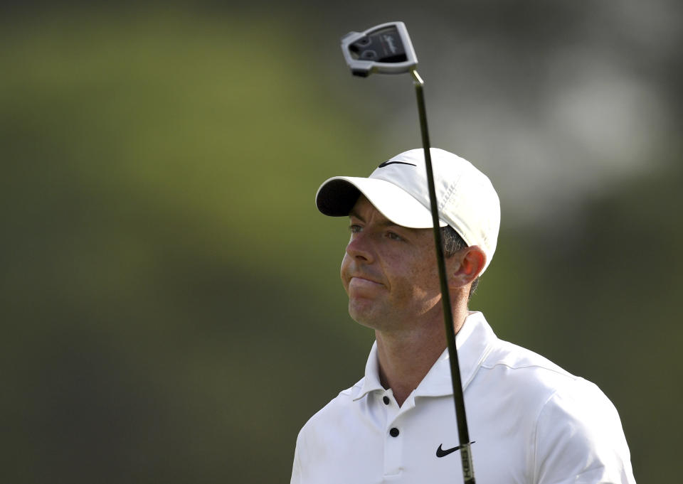 Rory McIlroy of Northern Ireland reacts after putting on the 18th green during DP World Tour Championship in Dubai, United Arab Emirates, Sunday, Nov. 20, 2022. (AP Photo/Martin Dokoupil)