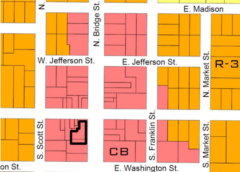 The site for a proposed three-story, mixed-use building in downtown DeWitt on a zoning map.