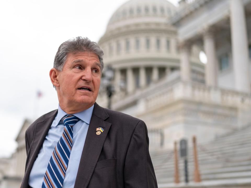 Sen Joe Manchin outside the Capitol building (AP)