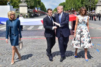 <p>French President Emmanuel Macron (2nd L) shakes hands with President Donald Trump, next to Macron’s wife Brigitte Macron (L) and First Lady Melania Trump during the traditional Bastille Day military parade on the Champs-Elysees avenue in Paris, France, July 14, 2017. (Photo: Christophe Archambault/Pool/Reuters) </p>