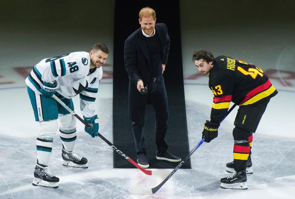 Prince Harry, Duke of Sussex, drops the puck during a face off between the Vancouver Canucks and the San Jose Sharks.
