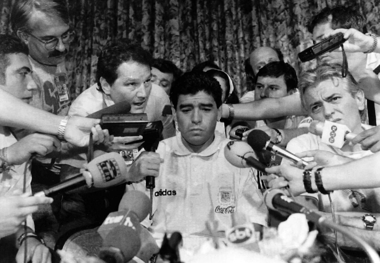 Argentina World Cup soccer player Diego Maradona is the center of media attention at The Sheraton Park Plaza hotel in Dallas, Texas, Thursday night, June 30, 1994. The Argentina Football Association dropped the 33-year-old forward from their World Cup soccer squad just hours before the team's final first rund game against Bulgaria, after it was revealed that he had tested positive for the use of banned drugs. (AP-Photo/Tim Sharp) 30.6.1994