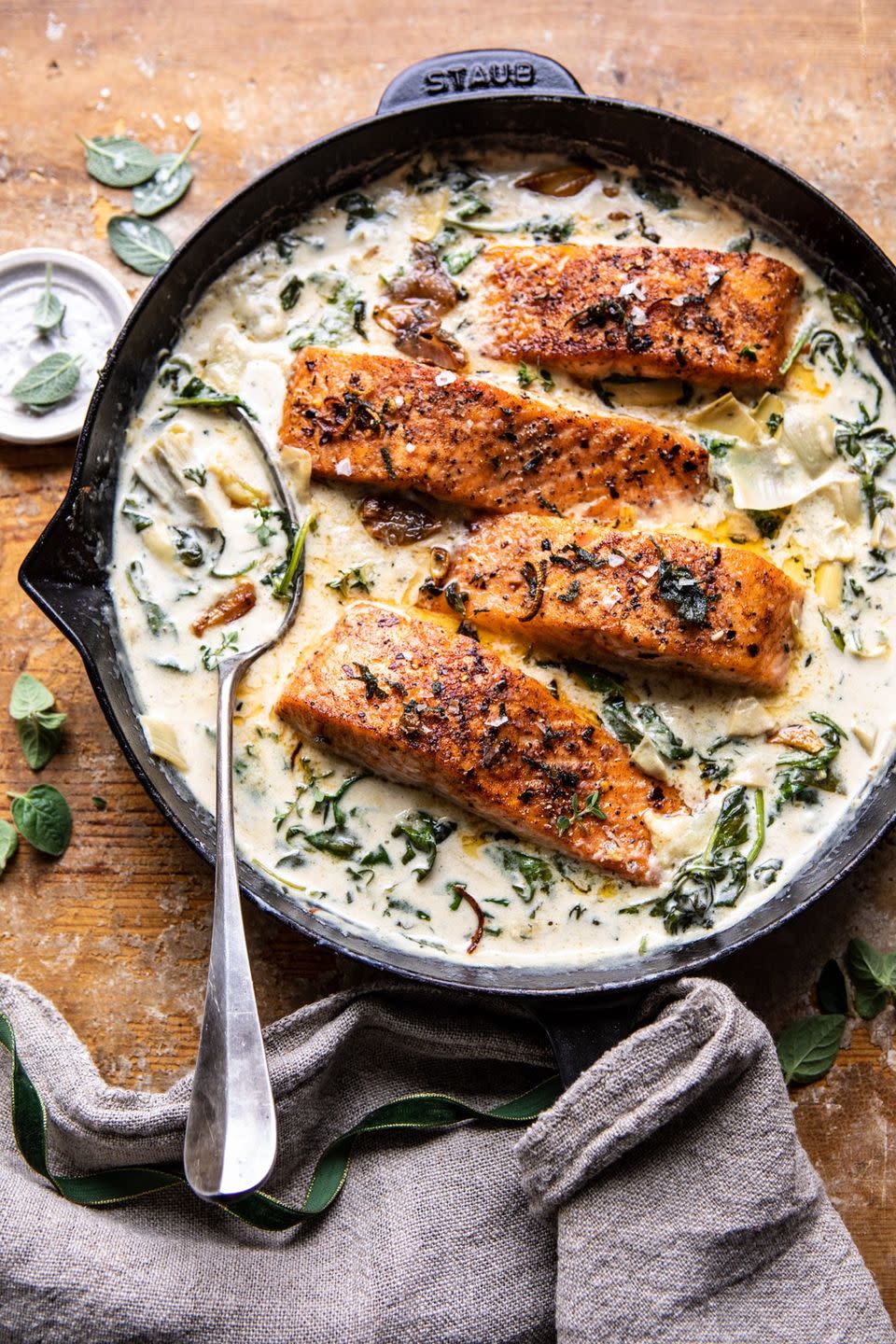 <p>You can whip up this creamy, buttery salmon dish in just over a half hour. The best part is that it tastes <em>just</em> like spinach and artichoke dip.</p><p><strong>Get the recipe at <a href="https://www.halfbakedharvest.com/creamy-spinach-and-artichoke-salmon/" rel="nofollow noopener" target="_blank" data-ylk="slk:Half Baked Harvest;elm:context_link;itc:0;sec:content-canvas" class="link ">Half Baked Harvest</a>.</strong></p><p><strong><strong><a class="link " href="https://www.amazon.com/Seasoned-Cast-Skillet-Utopia-Kitchen/dp/B00X4WQMAS?tag=syn-yahoo-20&ascsubtag=%5Bartid%7C10063.g.35055779%5Bsrc%7Cyahoo-us" rel="nofollow noopener" target="_blank" data-ylk="slk:SHOP CAST IRON SKILLETS;elm:context_link;itc:0;sec:content-canvas">SHOP CAST IRON SKILLETS</a></strong><br></strong></p>