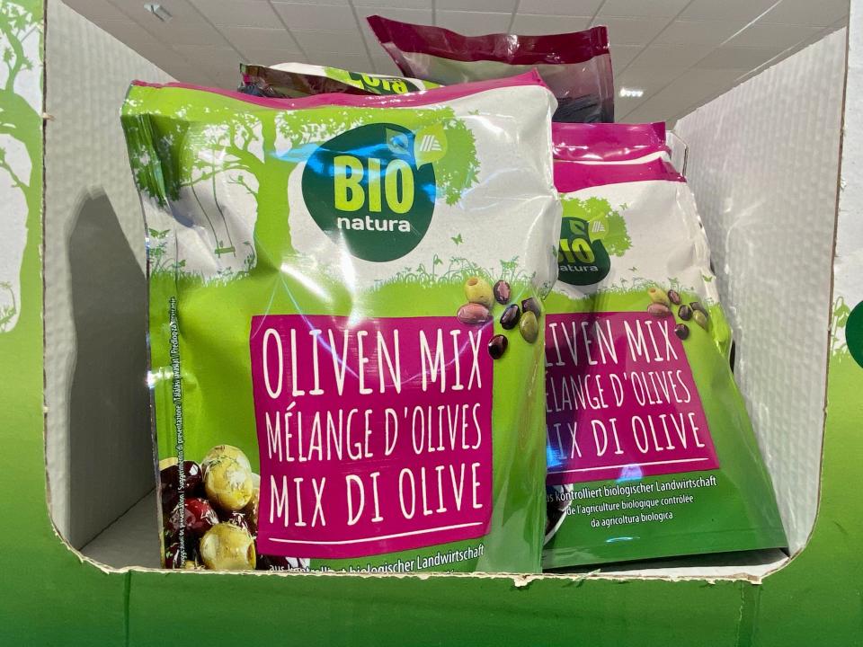 bags of mixed olives on the shelves at aldi