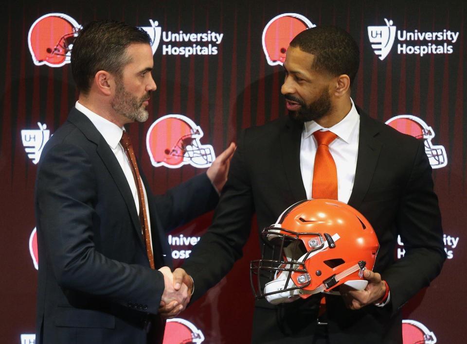 Browns head coach Kevin Stefanski, left, shakes hands with the team's new general manager Andrew Berry during his introductory press conference at the team's training facility, Wednesday, Feb. 5, 2020, in Berea.
