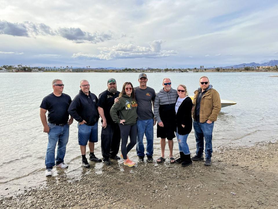 Members of the Fab Rats crew pose with the owners of a boat that sank in a frightening episode on Lake Powell in 1993. The crew retrieved and restored the boat nearly 30 years later.