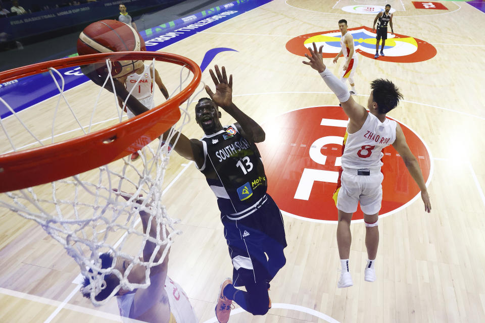 Majok Deng (13) of South Sudan drives to the basket against Zhao Rui (8) of China in the fourth quarter during the FIBA Basketball World Cup Group B game at Araneta Coliseum on August 28, 2023 in Manila, Philippines. (Yong Teck Lim/Pool photo via AP)