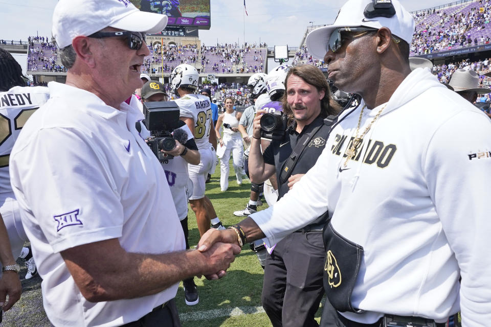 TCU head coach Sonny Dykes, left, and Colorado head coach Deion Sanders shake hands after an NCAA college football game Saturday, Sept. 2, 2023, in Fort Worth, Texas. (AP Photo/LM Otero)