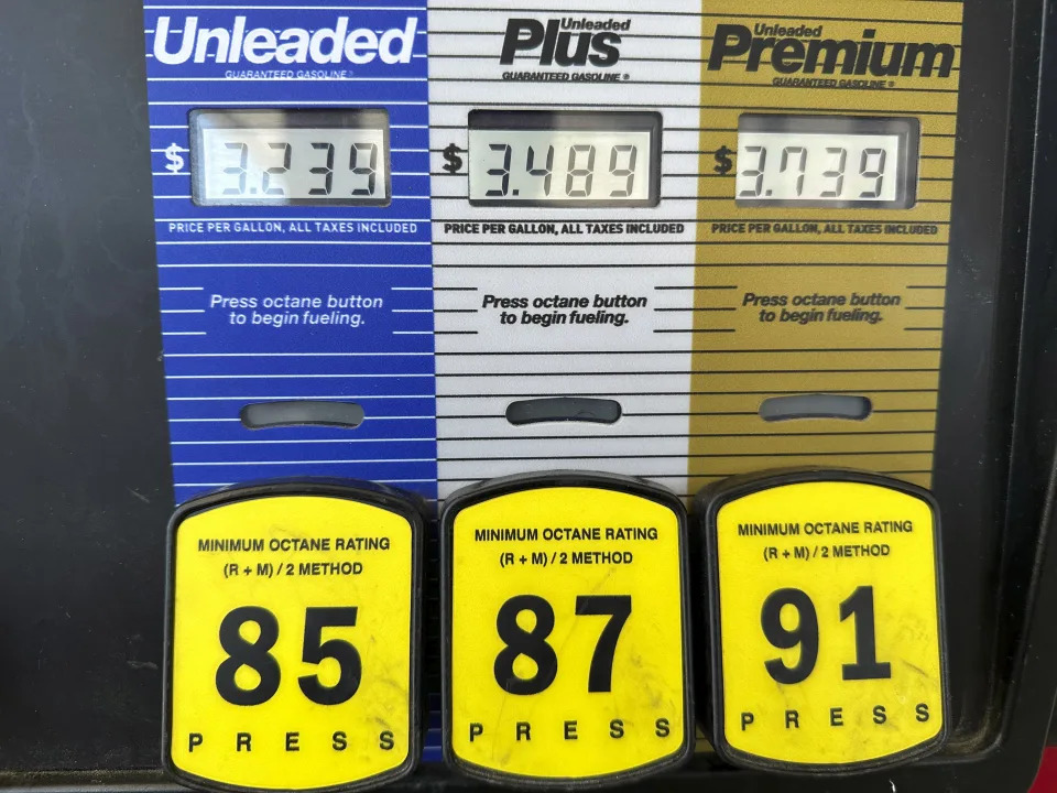 Prices are displayed above the various grades of gasoline available at a pump at a QT store Friday, Aug. 16, 2024, in Greenwood Village, Colo. (AP Photo/David Zalubowski)