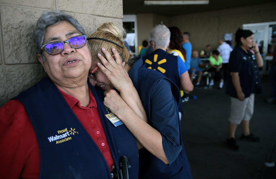 Walmart employees react after an active shooter opened fire at the store in El Paso, Texas, Saturday, Aug. 3, 2019. | Mark Lambie—The El Paso Times/AP