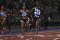 Britain's Dina Asher-Smith, right, wins the women's 200 meters event at the Diamond League track and field meeting in Florence, Italy, Thursday, June 10, 2021. (Alfredo Falcone/LaPresse via AP)