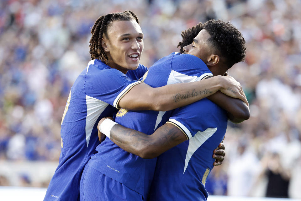 Chelsea's Ian Maatson, right, celebrates his goal against Wrexham with teammates during the first half of a club friendly soccer match Wednesday, July 19, 2023, in Chapel Hill, N.C. (AP Photo/Karl B DeBlaker)