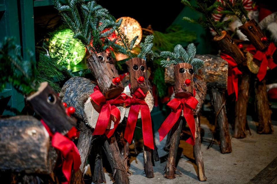 Wooden reindeer decorations for sale at Tannenbaum Farms on Monday, Nov. 20, 2023, in Mason.