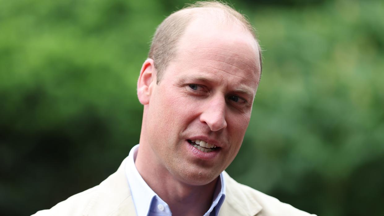  Prince William, Prince of Wales reacts as he visits Reach Up Youth 