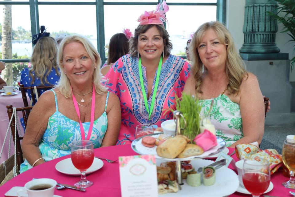 Jackie Sorrentino of Fort Lauderdale (from left) and Nancy Fish and Jill Manzo, both from Maine, enjoy afternoon tea at the Henry Morrison Flagler Museum as part of The Pink Retreat.