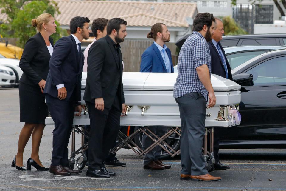 The coffin with Lucia and Emma Guara, killed when the 12-story Champlain Towers South crumbled, is carried into the St. Joseph Catholic Church in Surfside, Florida on July 6, 2021.