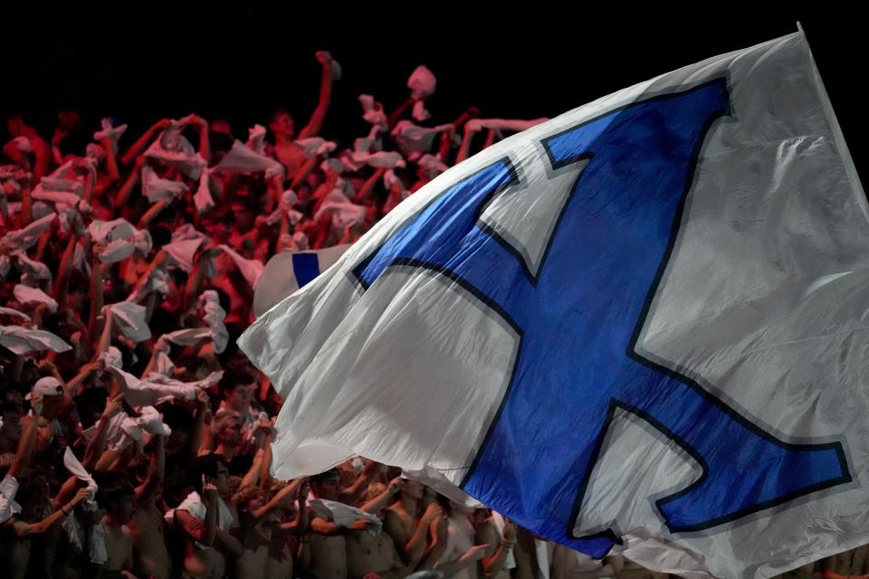 The St. Xavier Bombers student section cheers as a school flag is flown in the fourth quarter during a high school football game against the Lakota West Firebirds, Friday, Aug. 19, 2022, at Firebirds Stadium in West Chester Township, Ohio.